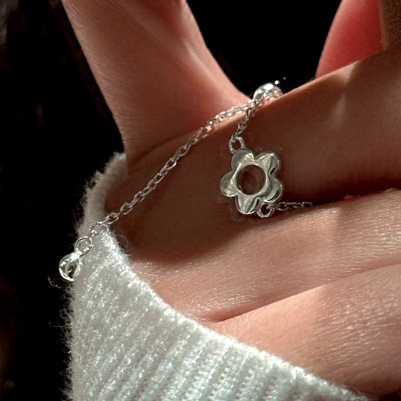 Close-up view of the gemstone and setting of the Flower Chain Ring