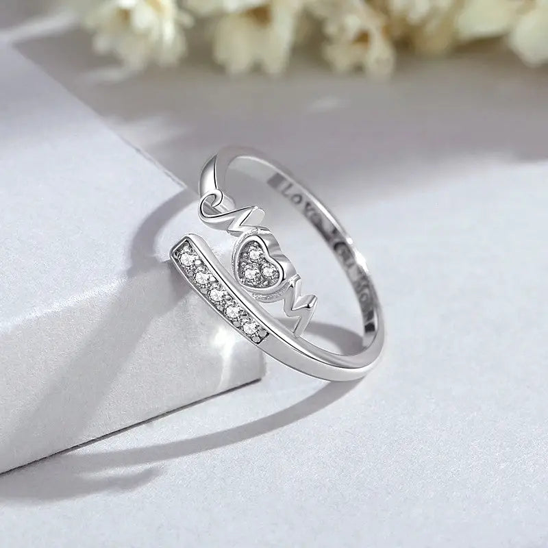 Top-down view of the sparkling Sterling Silver Adjustable Zircon Mom Rings