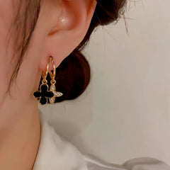 Model showcasing the dangle and style of the Sterling Silver Agate Four-Leaf Clover Earrings