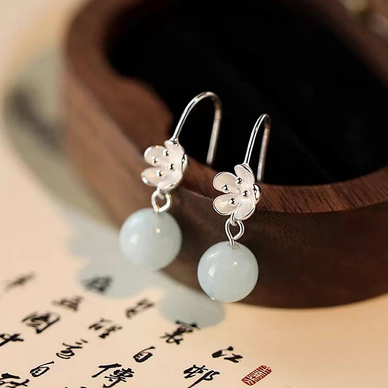 Close-up detail of the sparkling zircons and plating on the Flower Threader Earrings