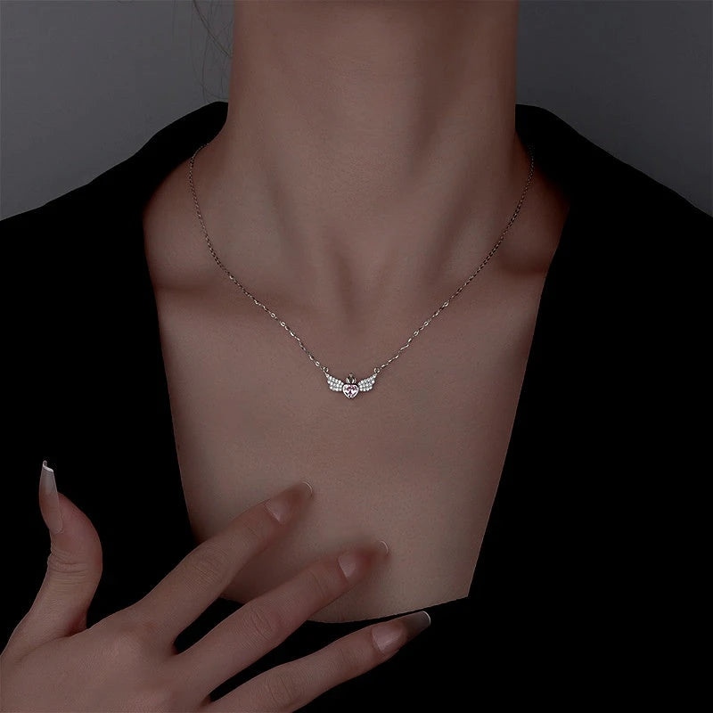 Close-up of the pendant and clasp on the Angel Wings Necklace