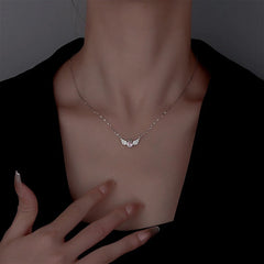 Close-up of the pendant and clasp on the Angel Wings Necklace