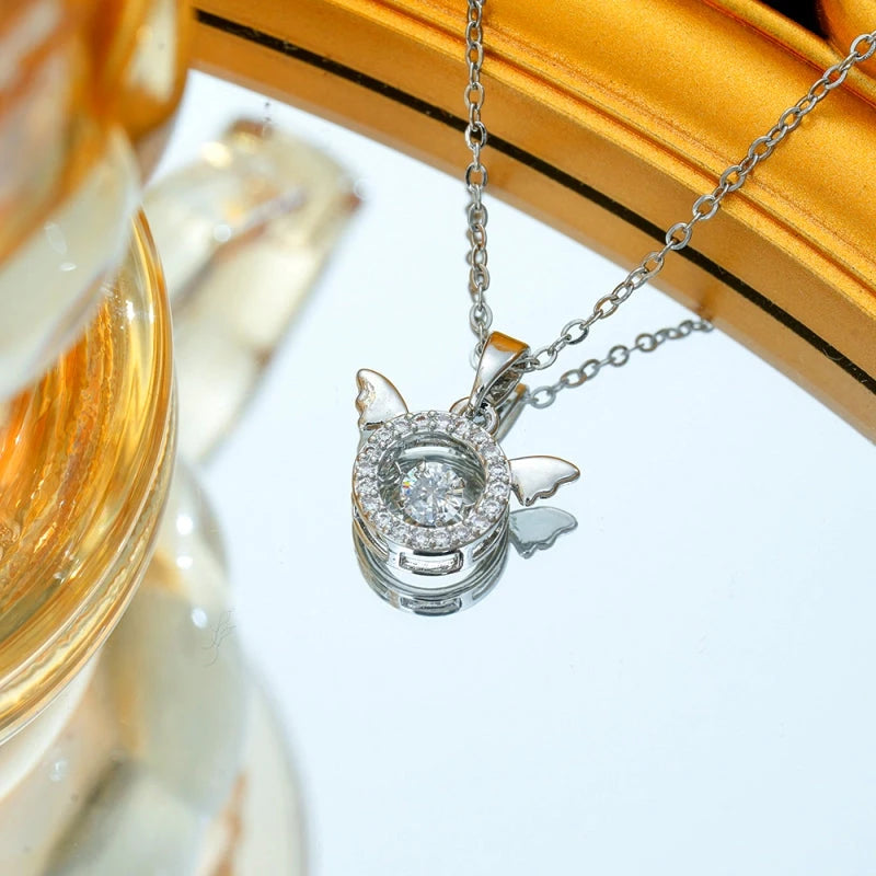 Close-up of the pendant and clasp on the Angel Wings Necklace