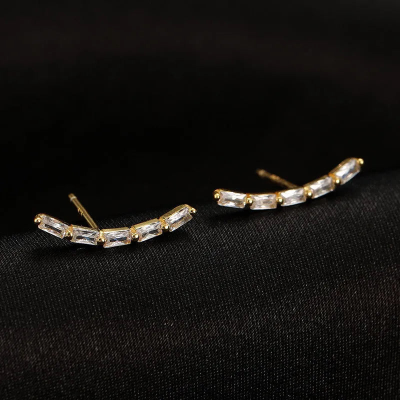 Angled view of the Sterling Silver Arc-Shaped Diamond Stud Earrings