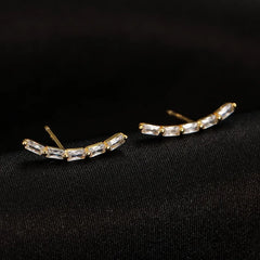 Angled view of the Sterling Silver Arc-Shaped Diamond Stud Earrings