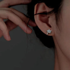 Close-up detail of the sparkling zircons and plating on the Asymmetrical Star Earrings