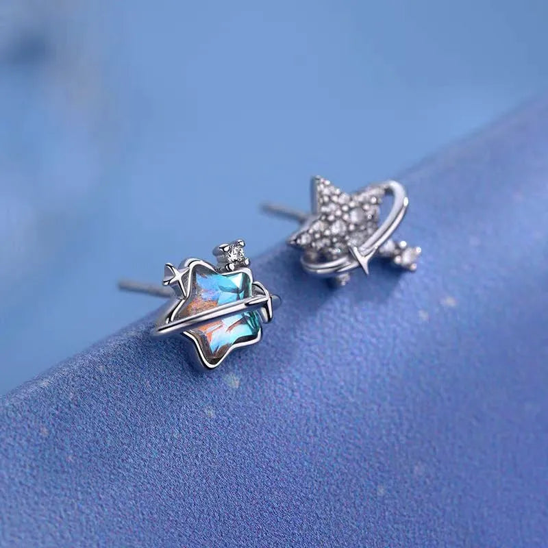 Model showcasing the dangle and style of the Sterling Silver Asymmetrical Star Earrings