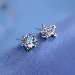 Model showcasing the dangle and style of the Sterling Silver Asymmetrical Star Earrings