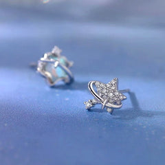 Angled view of the Sterling Silver Asymmetrical Star Earrings