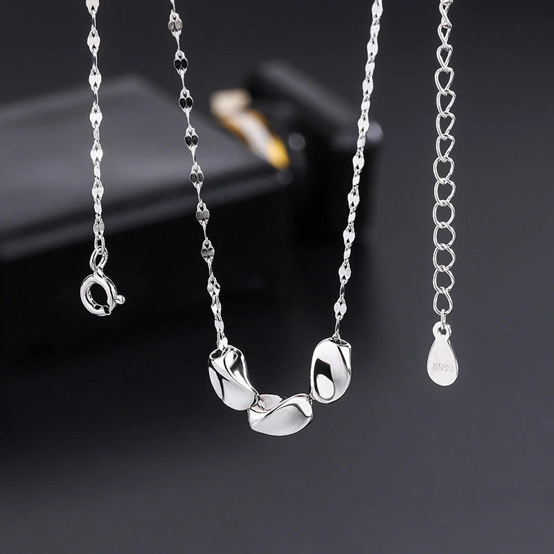 Sterling Silver Bean Necklace worn to showcase its length and pendant detail