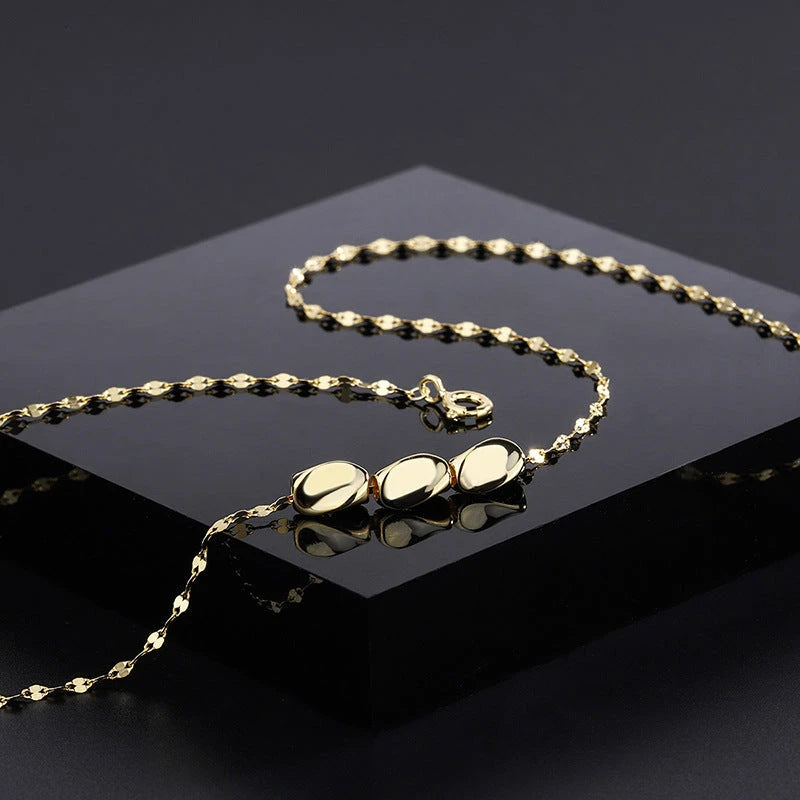 Detailed view of the Sterling Silver Bean Necklace chain and pendant