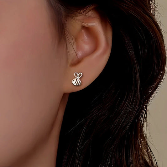 Model showcasing the dangle and style of the Sterling Silver Bee Stud Earring