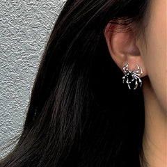 Model showcasing the dangle and style of the Sterling Silver Black Diamond Spider Stud Earrings