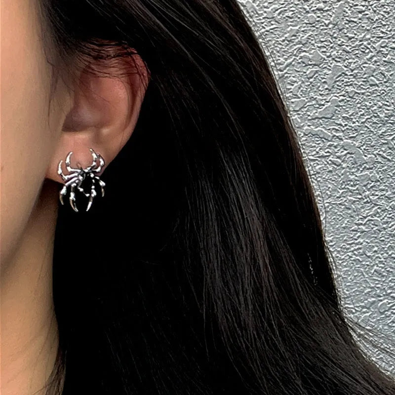 Close-up detail of the sparkling zircons and plating on the Spider Stud Earrings