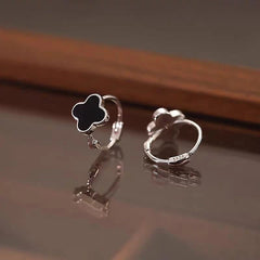 Close-up detail of the sparkling zircons and plating on the Clover Hoop Earrings