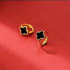 Angled view of the Sterling Silver Black Four-Leaf Clover Hoop Earrings