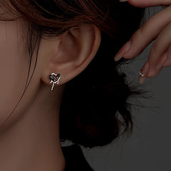 Close-up detail of the sparkling zircons and plating on the Black Heart Studs