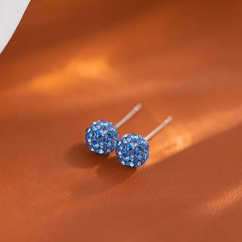 Angled view of the Sterling Silver Bling Diamond Ball Stud Earrings