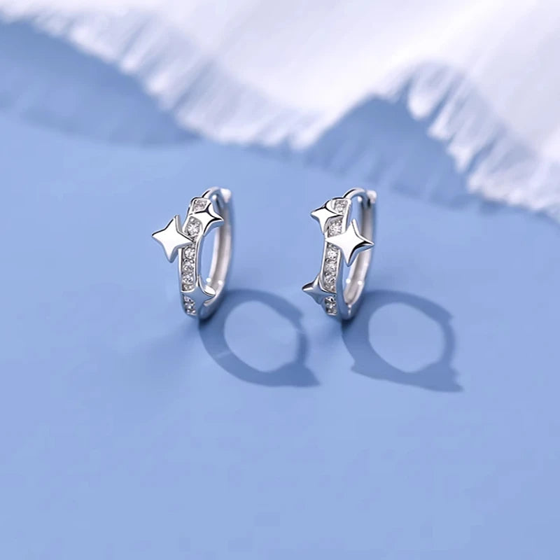 Close-up detail of the sparkling zircons and plating on the Star Hoop Earrings