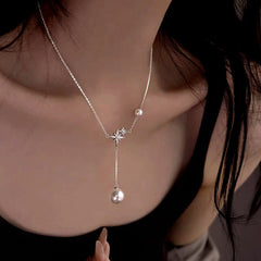 Detailed view of the Sterling Silver Bling Star Pearl Tassel Necklaces chain and pendant