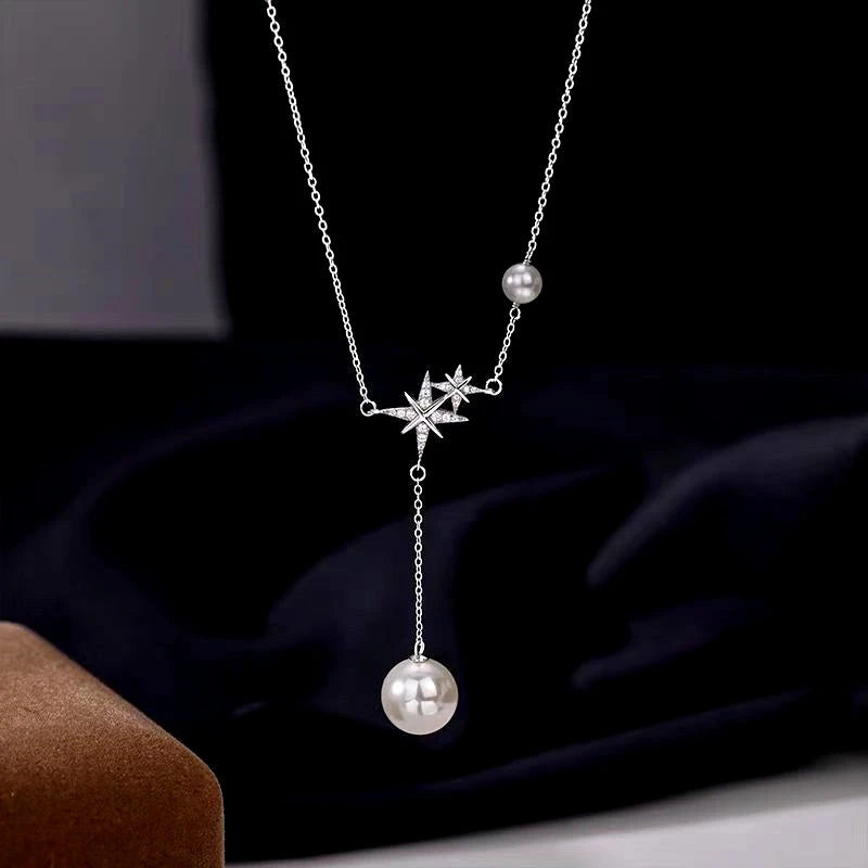 Sterling Silver Bling Star Pearl Tassel Necklaces worn to showcase its length and pendant detail