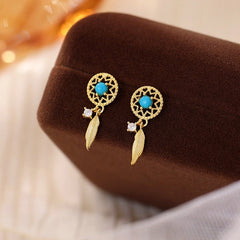 Angled view of the Sterling Silver Blue Bead Earrings