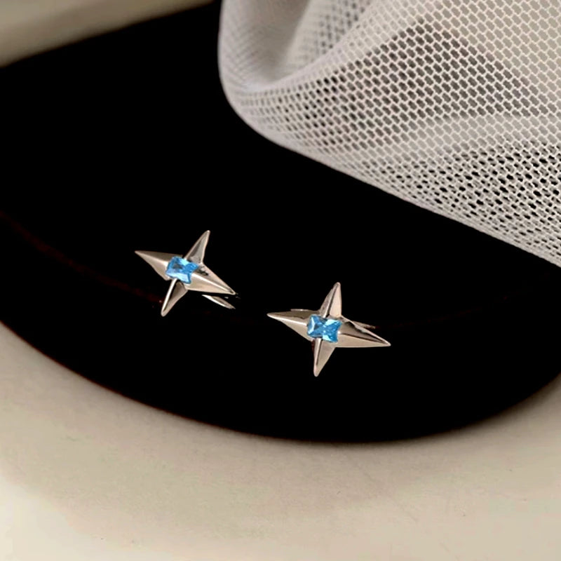 Angled view of the Sterling Silver Blue Zircon Star Ear Hook Earrings