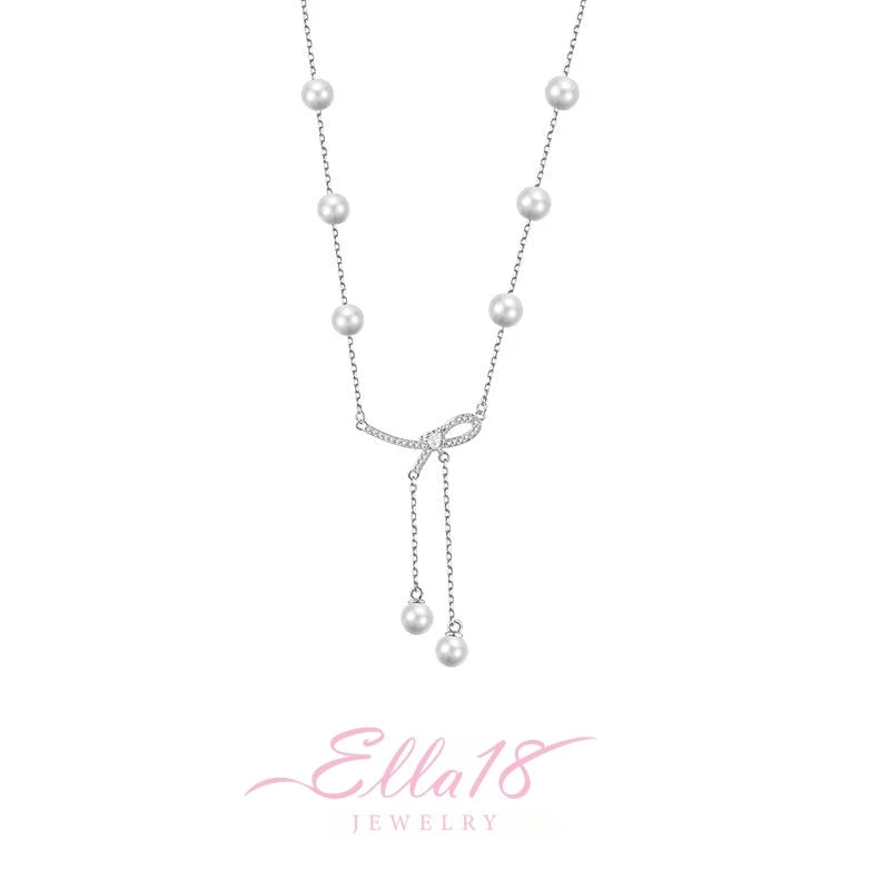 Detailed view of the Sterling Silver Bow Pearl Tassel Necklace chain and pendant