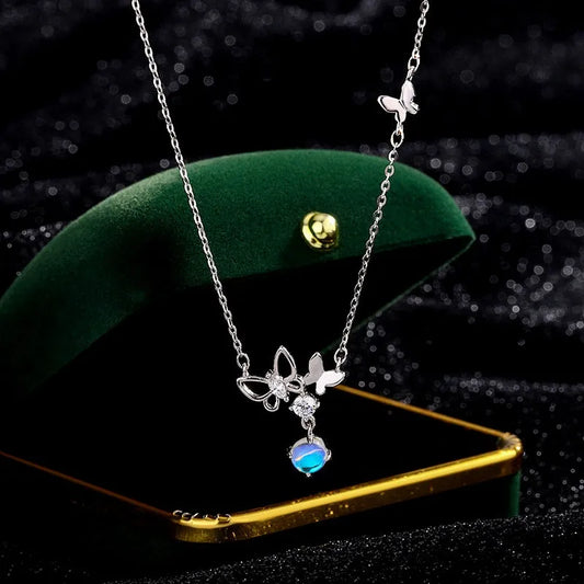 Sterling Silver Butterfly Moonstone Tassel Necklace worn to showcase its length and pendant detail