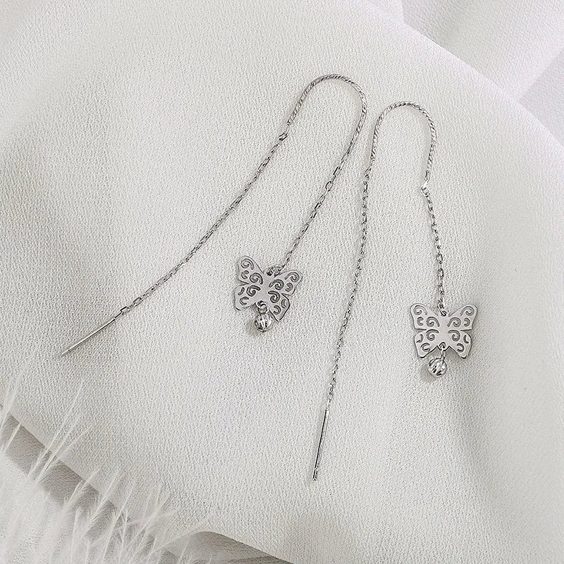 Close-up detail of the sparkling zircons and plating on the Butterfly Threader Earrings