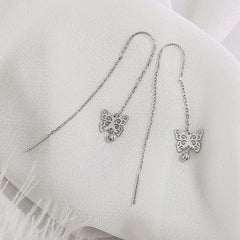 Close-up detail of the sparkling zircons and plating on the Butterfly Threader Earrings