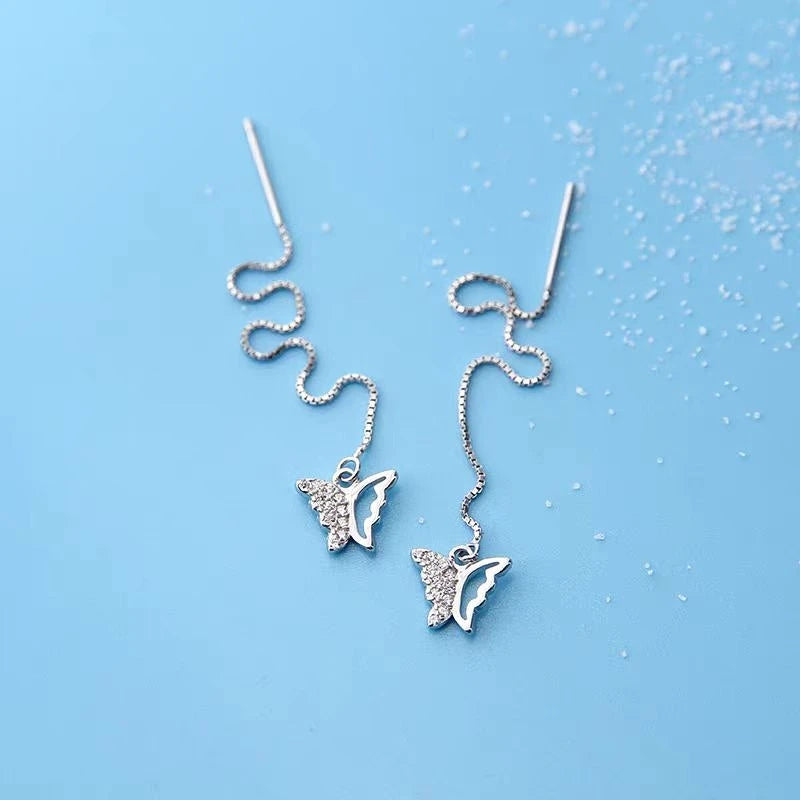 Close-up detail of the sparkling zircons and plating on the Butterfly Threader Earrings