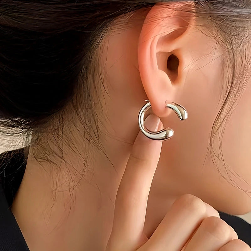 Model showcasing the dangle and style of the Sterling Silver C-Shaped Earrings