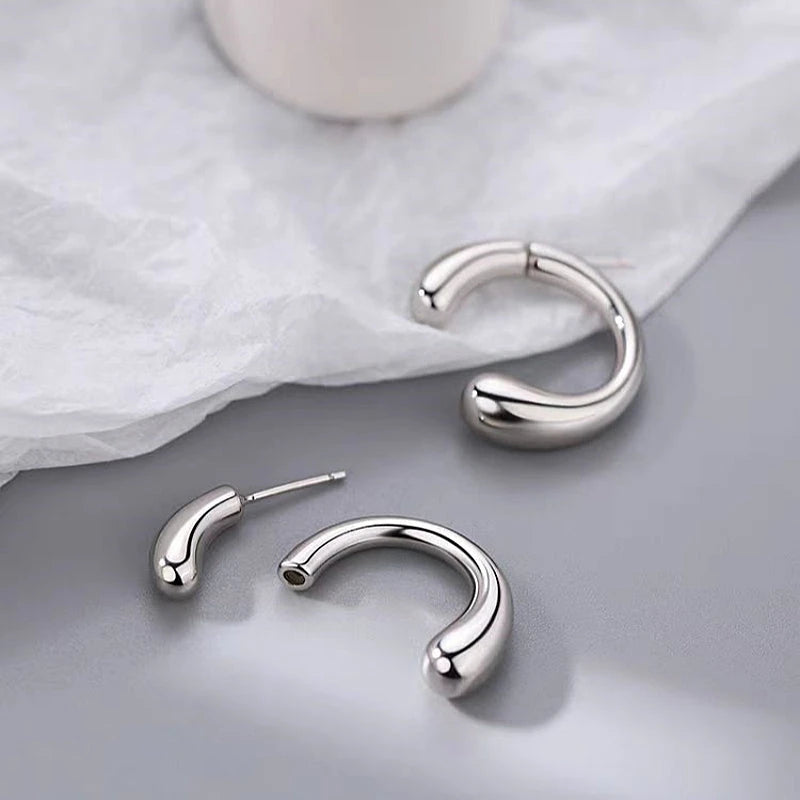 Angled view of the Sterling Silver C-Shaped Earrings
