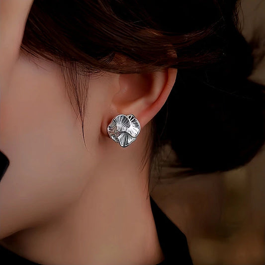 Model showcasing the dangle and style of the Sterling Silver Camellia Stud Earrings