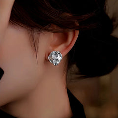 Model showcasing the dangle and style of the Sterling Silver Camellia Stud Earrings