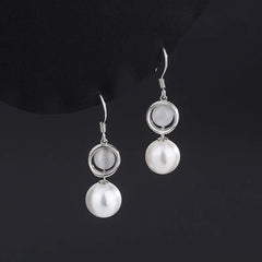 Close-up detail of the sparkling zircons and plating on the Pearl Ear Hooks