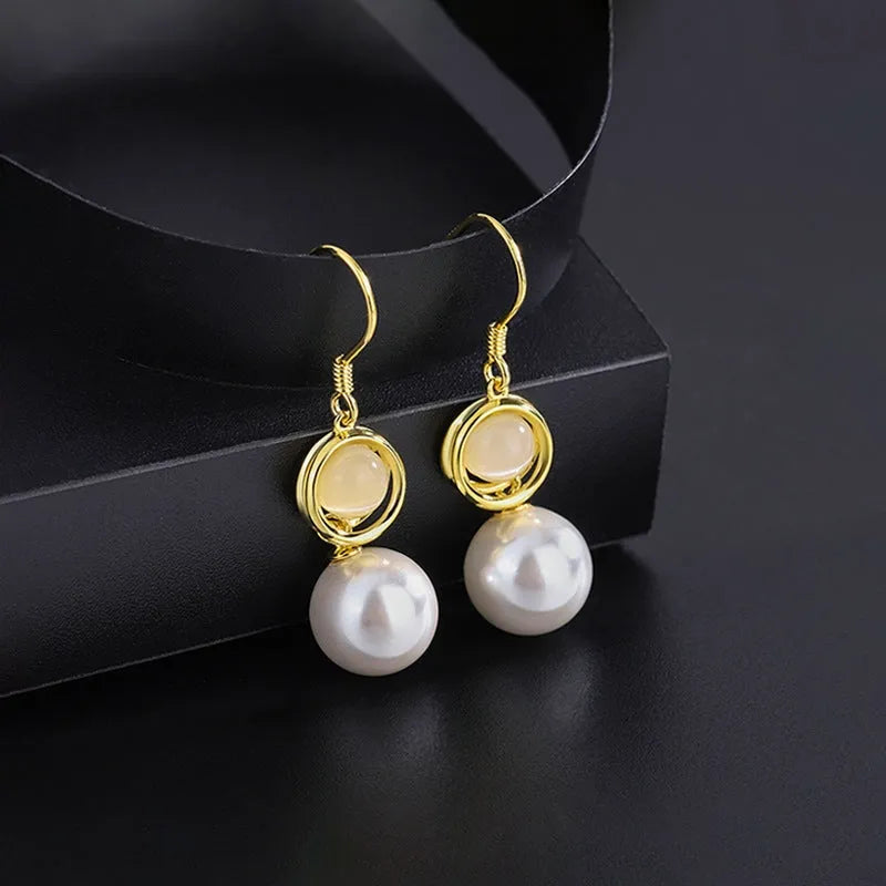 Angled view of the Sterling Silver Cat's Eye Stone Pearl Ear Hooks
