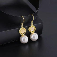 Angled view of the Sterling Silver Cat's Eye Stone Pearl Ear Hooks