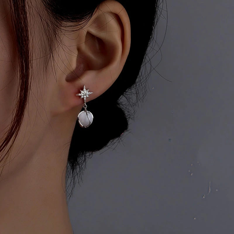 Angled view of the Sterling Silver Cat's Eye Stone Zircon Eight-Pointed Star Earrings