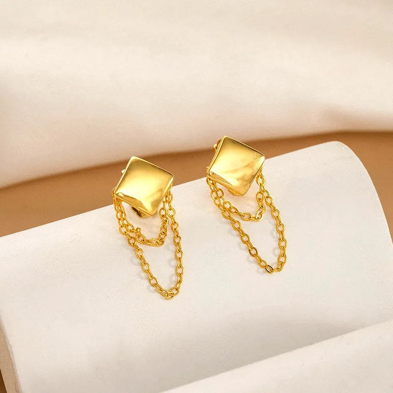 Angled view of the Sterling Silver Chain Tassel Earrings