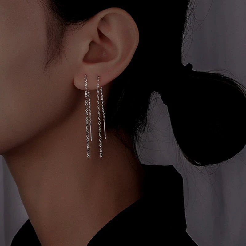 Model showcasing the dangle and style of the Sterling Silver Chain Thrreader Earrings