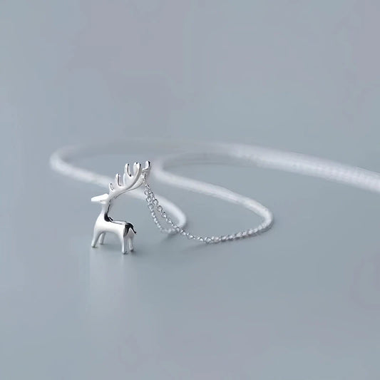 Sterling Silver Christmas Elk Pendant Necklace worn to showcase its length and pendant detail