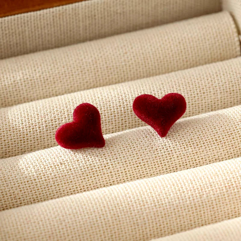 Angled view of the Sterling Silver Christmas Heart-Design Stud Earrings