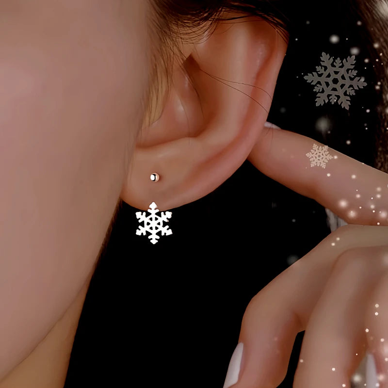 Model showcasing the dangle and style of the Sterling Silver Christmas Snowflake Earrings