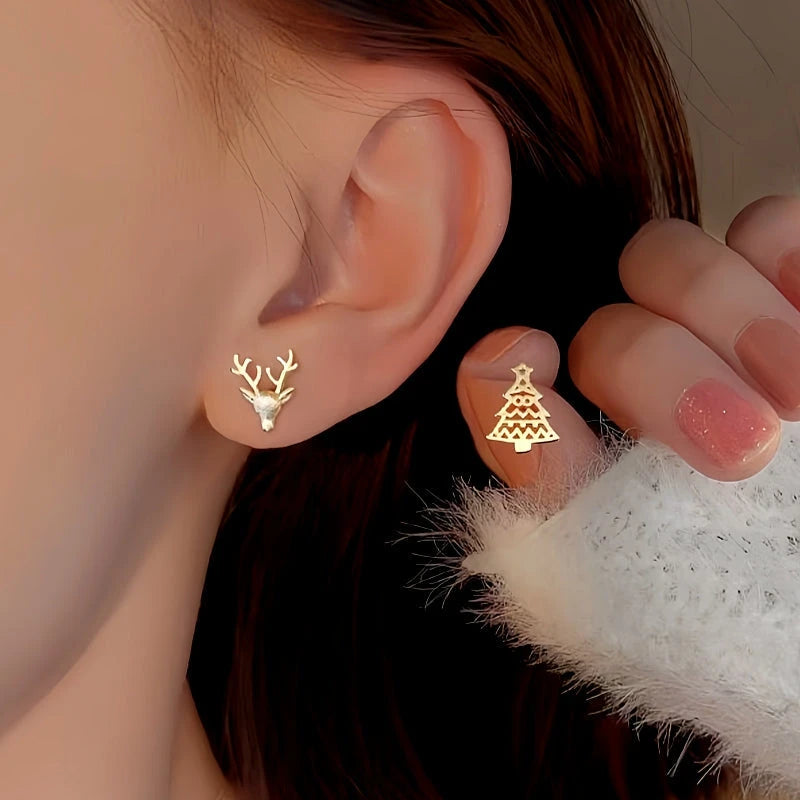 Model showcasing the dangle and style of the Sterling Silver Christmas Tree And Antler Asymmetrical Stud Earrings