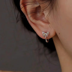 Close-up detail of the sparkling zircons and plating on the Butterfly Hoop Earrings