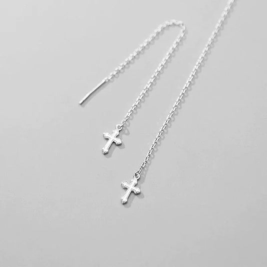 Model showcasing the dangle and style of the Sterling Silver Cross Threader Earrings