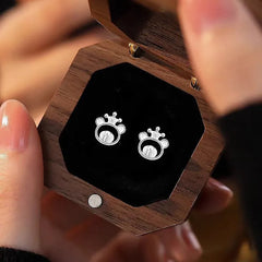 Close-up detail of the sparkling zircons and plating on the Crown Bear Studs