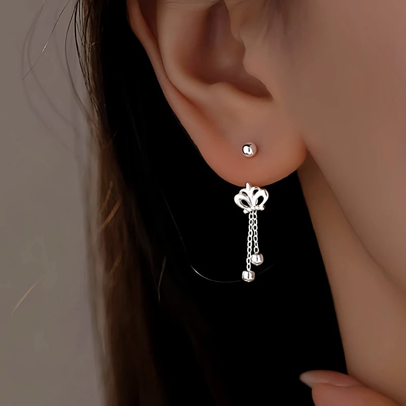 Close-up detail of the sparkling zircons and plating on the Crown Tassel Earrings